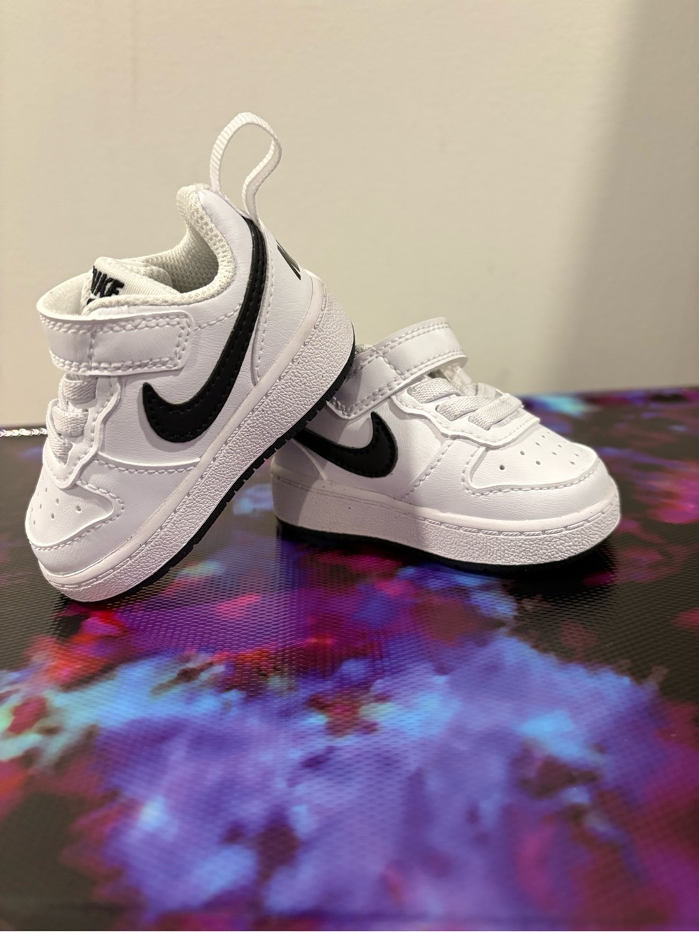 Nike Baby White Sneakers with Black Swoosh